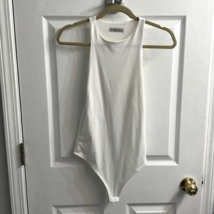 White thong solid tank bodysuit. Never worn